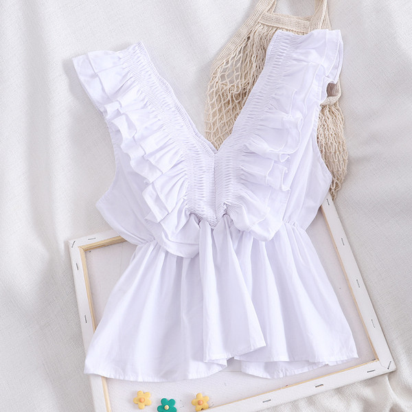 Modern női felső fürtökkel és spitz nyakkivágással