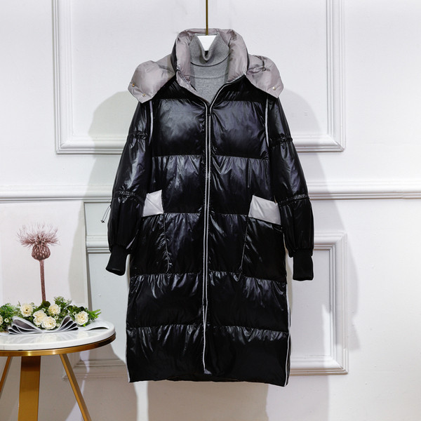 Μακρύ γυναικείο χειμερινό μπουφάν με κουκούλα και μεγάλες τσέπες