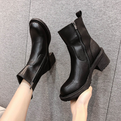 Kahes värvitoonis lameda tallaga naiste nahast saapad