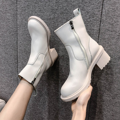 Kahes värvitoonis lameda tallaga naiste nahast saapad