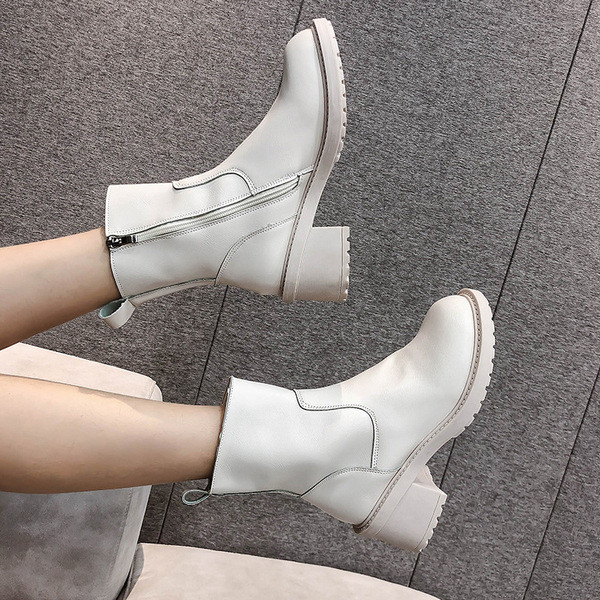 Kahes värvitoonis lameda tallaga naiste nahast saapad