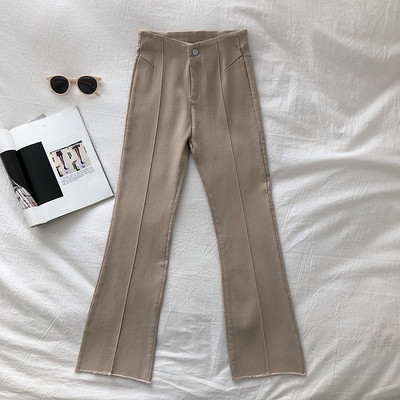 Moodsad kõrge vöökoha ja nööbiga naistepüksid