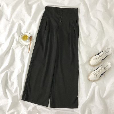 Φαρδύ μοντέλο γυναικείας παντελόνι με ψηλή μέση και κουμπιά