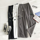 Naiste laiad elastse ja metallist ketiga püksid