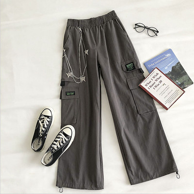 Naiste laiad elastse ja metallist ketiga püksid