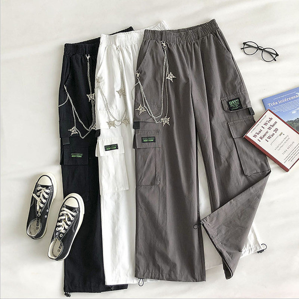 Naiste laiad elastse ja metallist ketiga püksid