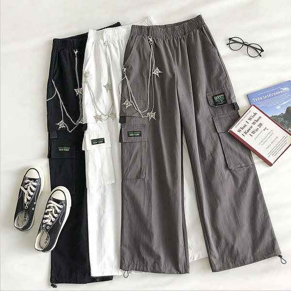 Naiste laiad elastse ja metallist ketiga püksid