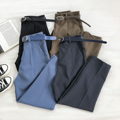 Modern női nadrág övvel és zsebbel