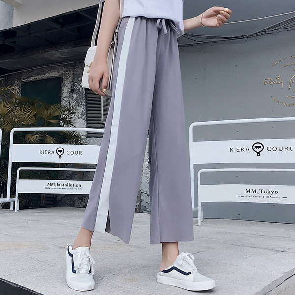 Női sportnadrág fehér szegéllyel és 9/10 hosszban