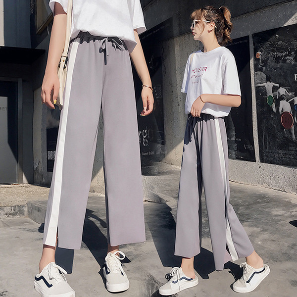 Női sportnadrág fehér szegéllyel és 9/10 hosszban