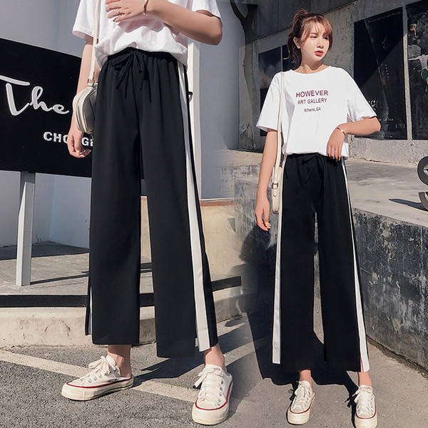 Női sportnadrág fehér szegéllyel és 9/10 hosszban