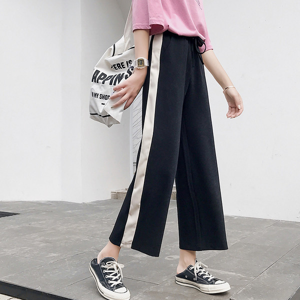 Naiste spordipüksid laiad 9/10 pikkuse ja ääristega mudel