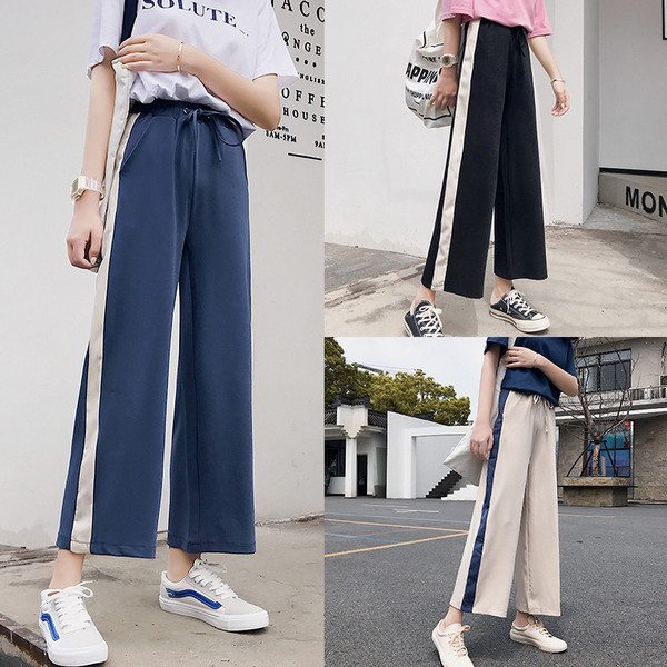 Naiste spordipüksid laiad 9/10 pikkuse ja ääristega mudel