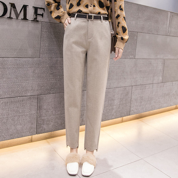 Ženske hlače - ravni model s džepovima i standardnim strukom