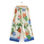 Naiste lilledega ja kummiga püksid