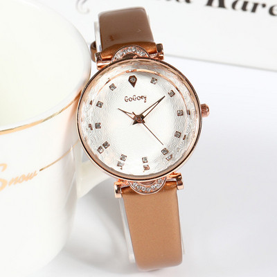 Ženski sat s tankim kožnim remenom i ukrasnim kamenčićima