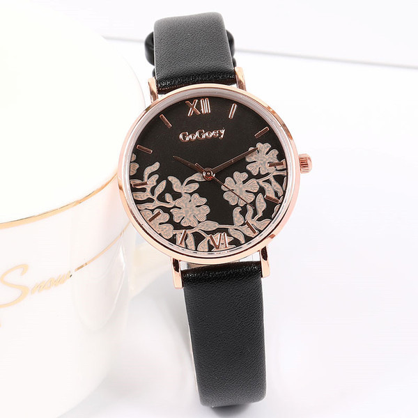 Nahast rihmaga ümmargune naiste käekell