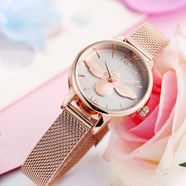 Naiste ümara kujuga metallist käekell