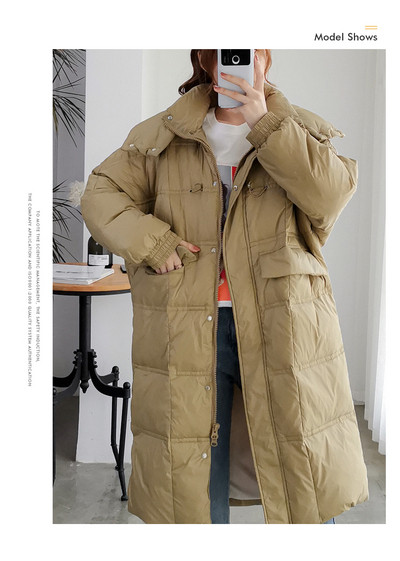 Μακρύ γυναικείο χειμερινό μπουφάν με τσέπες - φαρδιά μοντέλο
