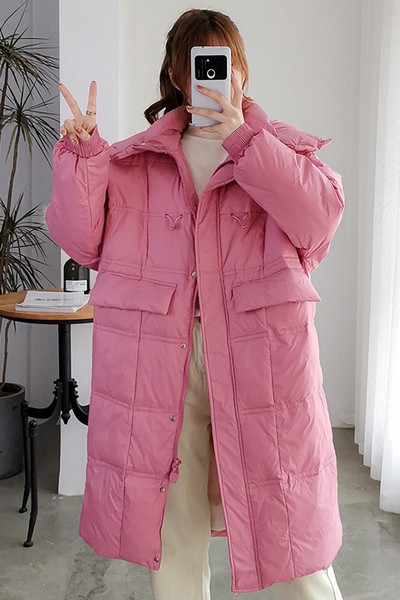 Μακρύ γυναικείο χειμερινό μπουφάν με τσέπες - φαρδιά μοντέλο