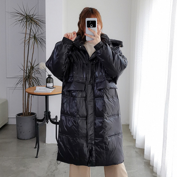 Μακρύ γυναικείο χειμερινό μπουφάν με τσέπες - φαρδιά μοντέλο