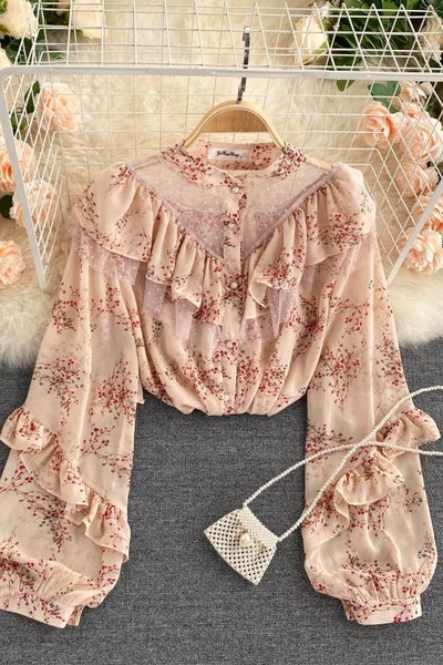 Lillemustri ja lokkidega naiste särgid