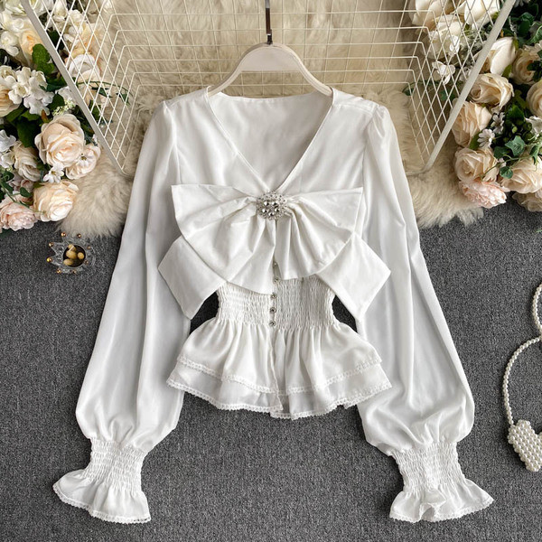 Stiilne naiste särk paela ja spitsikaelusega