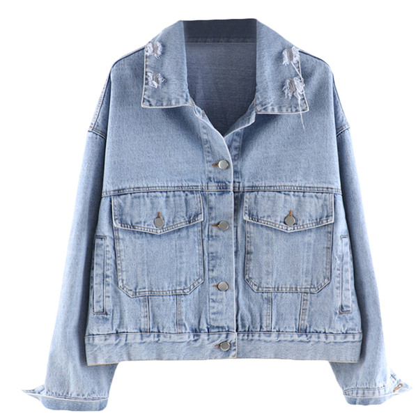 Modern női farmerdzseki zsebekkel, szakadt elemekkel