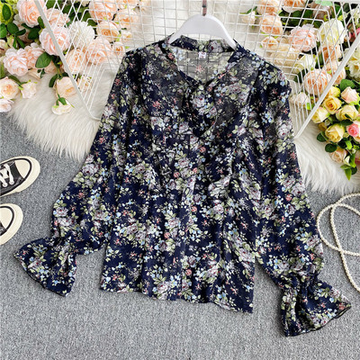 Lillemustri ja paelaga naiste särk kaeluses