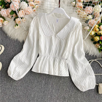 Stílusos női ing V-nyakkal és elasztikus derékkal