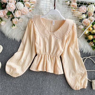 Stílusos női ing V-nyakkal és elasztikus derékkal