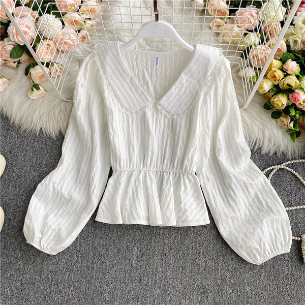 Stílusos női ing V-nyakkal és elasztikus derékkal