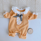 Kollane ovaalse kaelusega beebikombinesoon