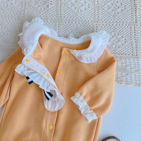 Kollane ovaalse kaelusega beebikombinesoon