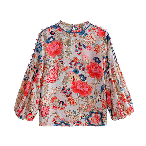 Laiade varrukatega ja lillelise mustriga naiste särk