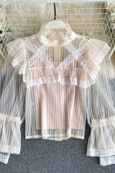 Moodne kõrge krae ja läbipaistvate varrukatega naiste särk