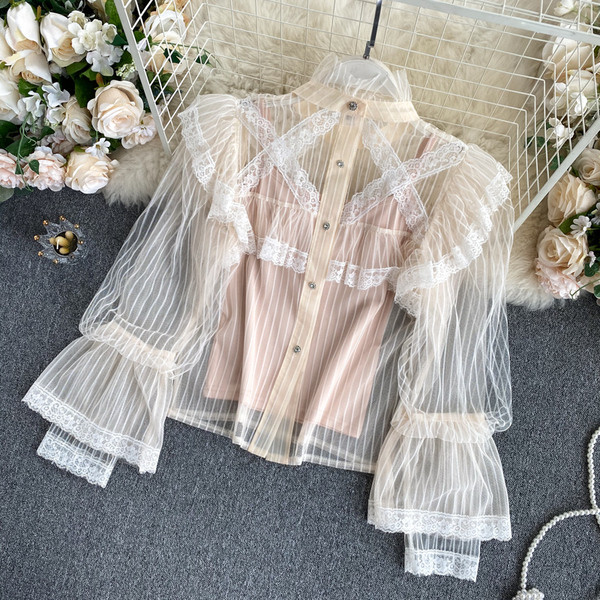 Moodne kõrge krae ja läbipaistvate varrukatega naiste särk