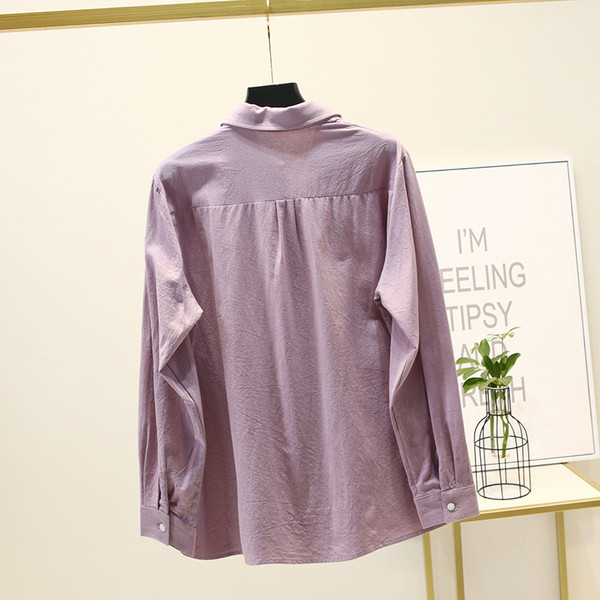 Suures suuruses pikkade varrukate ja tikanditega naiste särk