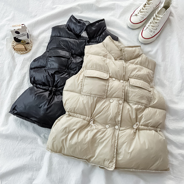 Női alkalmi mellény gumírozott derékkal és zsebekkel