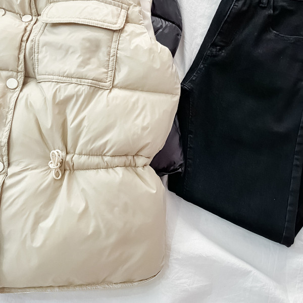 Női alkalmi mellény gumírozott derékkal és zsebekkel