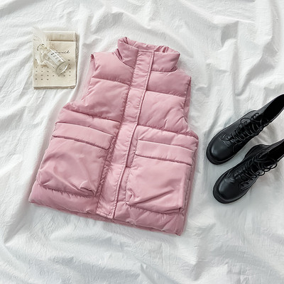 Női mellény ovális gallérral és zsebekkel