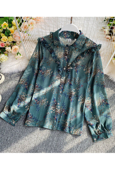 Lillemustri ja nööpidega lokkidega naiste särk