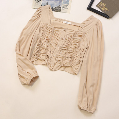 Kandilise kaelusega ja pikkade varrukatega naiste särk