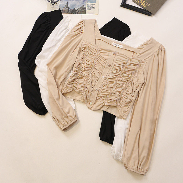 Kandilise kaelusega ja pikkade varrukatega naiste särk