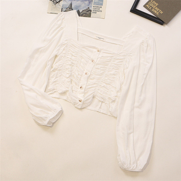 Kandilise kaelusega ja pikkade varrukatega naiste särk