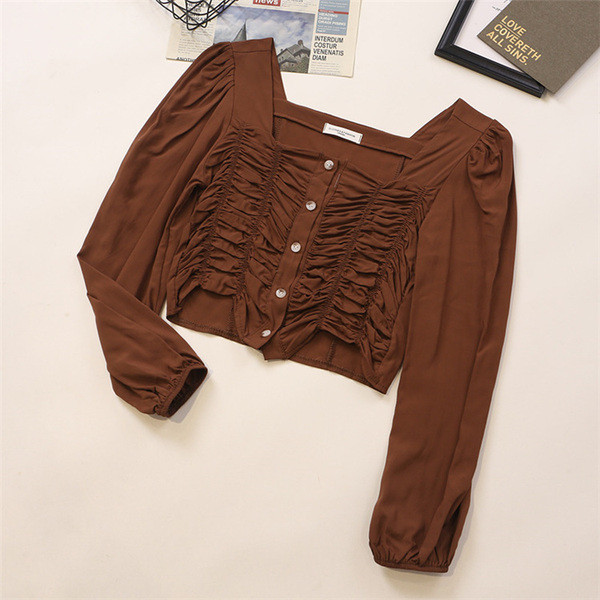 Kandilise kaelusega ja pikkade varrukatega naiste särk