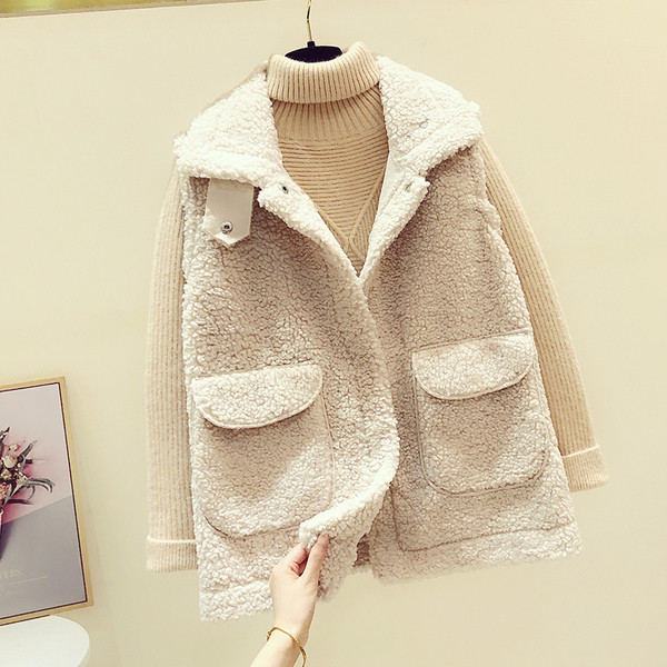 Női pehelymellény zsebekkel és cipzárral