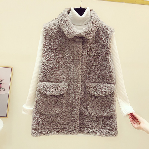 Női pehelymellény zsebekkel és cipzárral