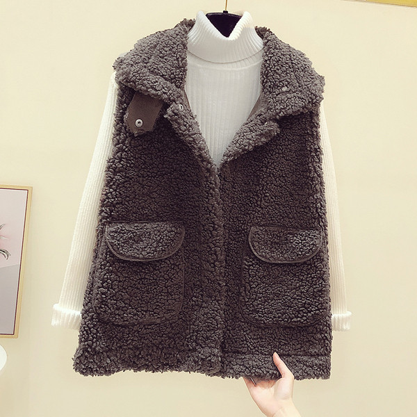 Női pehelymellény zsebekkel és cipzárral