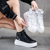 Naiste mustad ja valged paeltega tossud